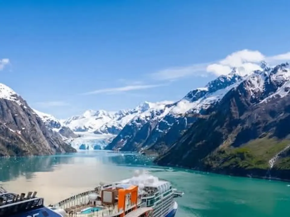 A cruise ship in a glacial mountain fjord
