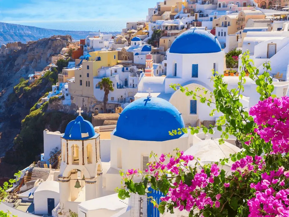 White buildings and blue domes above the sea in Santorini